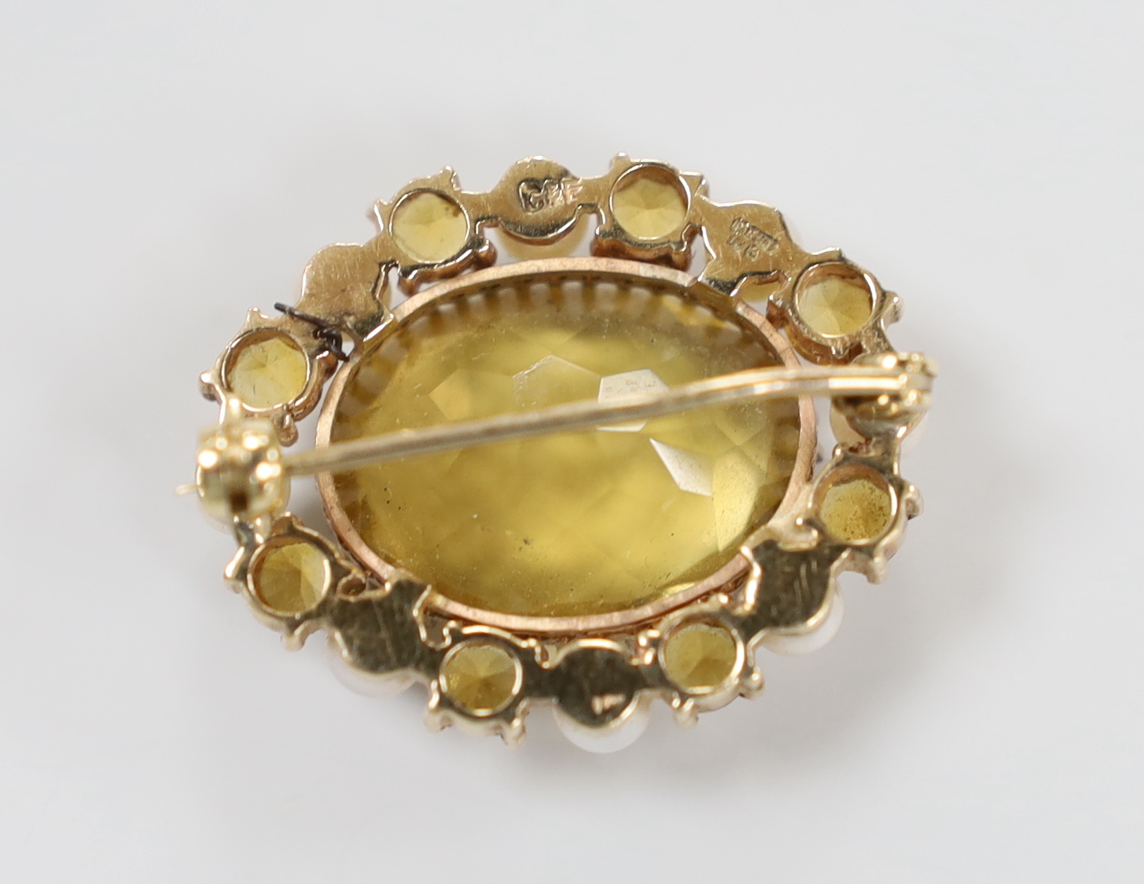 A modern 9ct gold mounted, citrine and cultured pearl set oval brooch, by Cropp & Farr, 30mm, gross weight 9.4 grams.